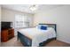 This bedroom features a ceiling fan, large window and space for storage at 131 Helmswood Sw Cir, Marietta, GA 30064