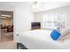 Comfortable bedroom with large window and view into the adjacent living space at 131 Helmswood Sw Cir, Marietta, GA 30064