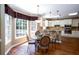 Cozy dining area with natural light pouring through bay windows, adjacent to a modern kitchen at 131 Helmswood Sw Cir, Marietta, GA 30064