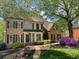 Classic brick home with professionally landscaped yard and covered entrance at 131 Helmswood Sw Cir, Marietta, GA 30064