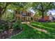 Beautifully landscaped front yard with walkway leading to a traditional brick home at 131 Helmswood Sw Cir, Marietta, GA 30064