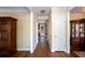 Inviting hallway with wood floors and natural light, enhanced by classic trim and neutral wall colors at 131 Helmswood Sw Cir, Marietta, GA 30064