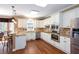 Bright kitchen features granite counters, stainless appliances and cabinetry under recessed and pendant lighting at 131 Helmswood Sw Cir, Marietta, GA 30064