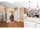 This kitchen boasts granite countertops, and seamless access to the staircase and dining area at 131 Helmswood Sw Cir, Marietta, GA 30064