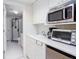 Functional kitchenette with white cabinets, sink, and modern appliances at 131 Helmswood Sw Cir, Marietta, GA 30064
