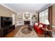 The living room features a fireplace, built-in shelving, hardwood floors, and a large window at 131 Helmswood Sw Cir, Marietta, GA 30064