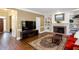 The living room features a brick fireplace, built-in shelving, and hardwood floors at 131 Helmswood Sw Cir, Marietta, GA 30064