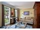 Inviting living room with piano and large windows, creating a cozy and bright atmosphere at 131 Helmswood Sw Cir, Marietta, GA 30064