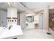 Large bathroom with dual vanities, a jacuzzi tub, and two separate entrance doorways leading to other bathroom areas at 131 Helmswood Sw Cir, Marietta, GA 30064