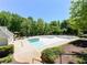 Community pool with lush landscaping and ample space for relaxing and recreation at 131 Helmswood Sw Cir, Marietta, GA 30064