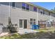 Backyard features a concrete patio, with mature trees and exterior of the home at 168 Ellis Dr, Conyers, GA 30012