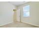 Bright bedroom with a window and neutral walls at 168 Ellis Dr, Conyers, GA 30012