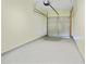 Clean, empty garage with gray epoxy floor, awaiting your personal touch and vehicles at 168 Ellis Dr, Conyers, GA 30012