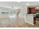 Inviting living space with wood floors, ceiling fan, and natural light flowing into the open floor plan at 168 Ellis Dr, Conyers, GA 30012