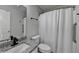 Bathroom featuring a single vanity with granite countertop, updated fixtures, and walk-in shower at 1965 Winnstead Pl, Loganville, GA 30052