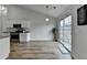 Bright dining area with sliding glass doors to the backyard and hardwood flooring at 1965 Winnstead Pl, Loganville, GA 30052