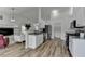 Open-concept kitchen featuring granite countertops and stainless steel appliances at 1965 Winnstead Pl, Loganville, GA 30052