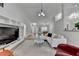 Bright, open living room featuring vaulted ceilings, modern lighting, and stylish decor at 1965 Winnstead Pl, Loganville, GA 30052