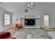 Spacious living room with vaulted ceiling, built-in shelving, and modern decor at 1965 Winnstead Pl, Loganville, GA 30052