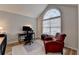 Office featuring a large arched window and comfortable seating, perfect for working from home at 1965 Winnstead Pl, Loganville, GA 30052
