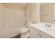 Bathroom featuring a shower over tub, white vanity, tile flooring, toilet, mirror, and a neutral color palette at 272 Ascott Ln, Woodstock, GA 30189