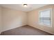 Bedroom featuring neutral paint, plush carpet, and a window with white blinds at 272 Ascott Ln, Woodstock, GA 30189