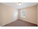 Neutral bedroom featuring plush carpet, a window with blinds, and a simple ceiling light at 272 Ascott Ln, Woodstock, GA 30189