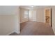 Bedroom featuring neutral paint, plush carpet, window, closet and adjacent doorway at 272 Ascott Ln, Woodstock, GA 30189