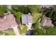 Aerial view of the house shows a well-manicured lawn and mature trees surrounding the property at 890 Muirfield Rdg, Marietta, GA 30068