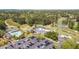An aerial view of Indian Hills Country Club features a golf course, tennis courts, and pool at 890 Muirfield Rdg, Marietta, GA 30068