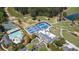 Aerial view features tennis courts, swimming pool, golf course, and clubhouse amenities at 890 Muirfield Rdg, Marietta, GA 30068