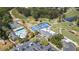 An aerial view showcases tennis courts, a pool, and a golf course at Indian Hills at 890 Muirfield Rdg, Marietta, GA 30068