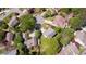 An aerial view showcases a neighborhood with lush green trees and well-maintained homes at 890 Muirfield Rdg, Marietta, GA 30068