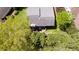 Aerial view of the backyard with a patio area surrounded by mature trees and greenery at 890 Muirfield Rdg, Marietta, GA 30068