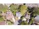An overhead view features houses with mature landscaping and colorful flower beds at 890 Muirfield Rdg, Marietta, GA 30068