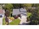Aerial view of a charming home showcasing its well-maintained landscaping and double-door entryway at 890 Muirfield Rdg, Marietta, GA 30068