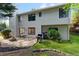 Backyard view of home features sliding glass doors, a patio, and stainless steel grill at 890 Muirfield Rdg, Marietta, GA 30068