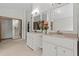 Bathroom with double vanities, framed mirrors, neutral countertops and sliding closet doors at 890 Muirfield Rdg, Marietta, GA 30068
