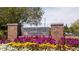 The Indian Hills Country Club brick sign is enhanced with colorful flowers at 890 Muirfield Rdg, Marietta, GA 30068