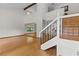 Open-concept entryway with soaring ceilings, hardwood floors, and abundant natural light from large windows at 890 Muirfield Rdg, Marietta, GA 30068