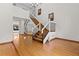 Open-concept entryway with hardwood floors and a staircase leading to the upper level at 890 Muirfield Rdg, Marietta, GA 30068