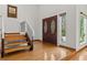 Entryway with double doors, hardwood floors, and a staircase leading to the upper level at 890 Muirfield Rdg, Marietta, GA 30068