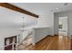 Hardwood foyer with views to the staircase and front door entryway at 890 Muirfield Rdg, Marietta, GA 30068
