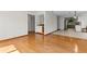 Open living space featuring hardwood floors, a built-in wet bar, and access to the kitchen at 890 Muirfield Rdg, Marietta, GA 30068