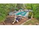 Aerial view of the community pool, playground, and surrounding green spaces, showcasing amenities at 989 Vendue Dr, Lawrenceville, GA 30044