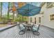 Deck area with table, chairs, and umbrella at 989 Vendue Dr, Lawrenceville, GA 30044