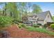 Spacious backyard with lush landscaping, a gazebo, and a deck, ideal for outdoor activities at 989 Vendue Dr, Lawrenceville, GA 30044