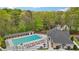 Aerial view of the community pool and clubhouse with ample seating for residents and guests at 989 Vendue Dr, Lawrenceville, GA 30044