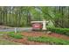 Flowers Crossing community sign surrounded by manicured landscaping near a quiet street at 989 Vendue Dr, Lawrenceville, GA 30044