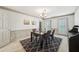 Traditional dining room featuring an elegant chandelier and decorative rug at 989 Vendue Dr, Lawrenceville, GA 30044